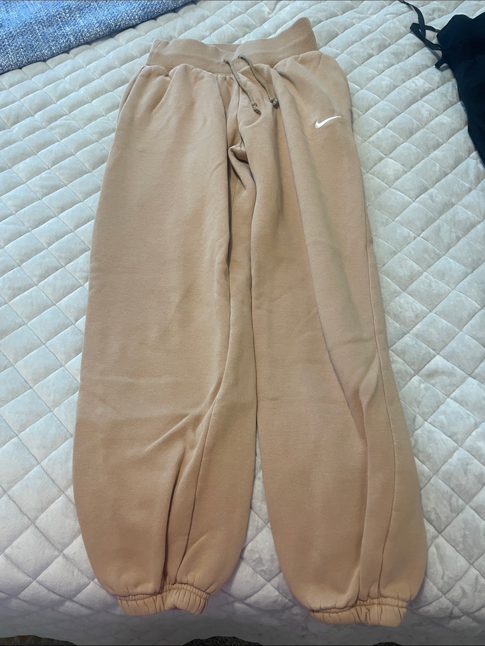 Nike beige fleece joggers with white Swoosh